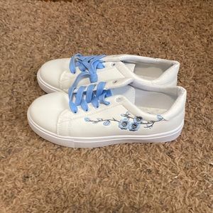 White flowery sneakers